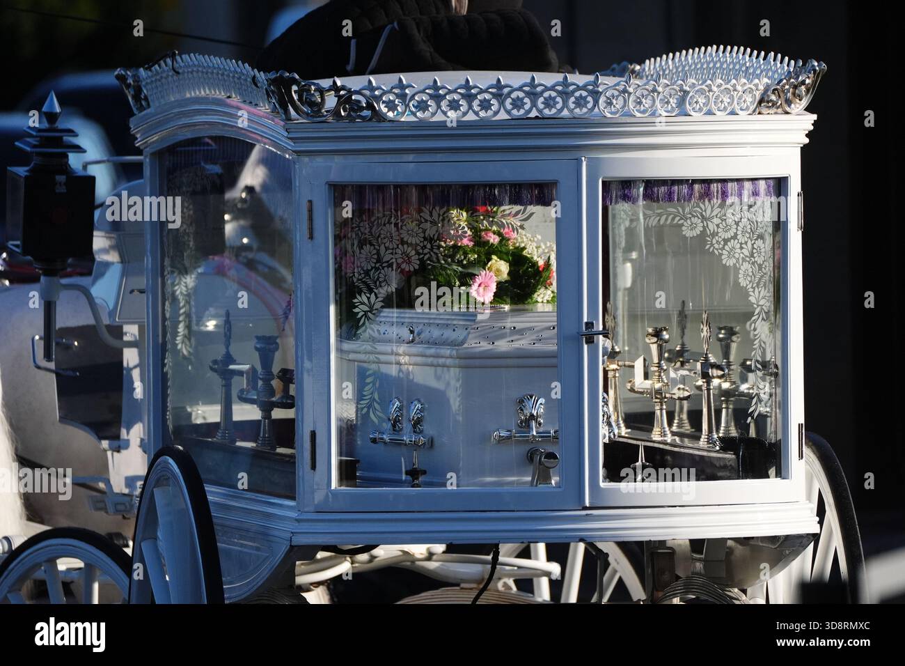 The coffin arrives by horse drawn hearse for the funeral of Chloe Hipson at Daldowie Crematorium in Glasgow. 21-year-old Chloe was one of five people killed when their Volkswagen Golf was in a collision with a Toyota Land Cruiser on a road near Dundalk on November 15. Picture date: Tuesday December 2, 2025. Stock Photo