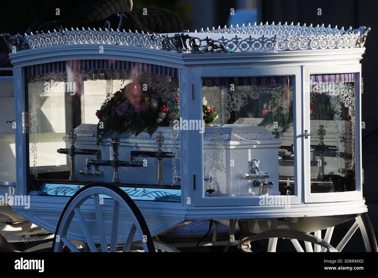 The coffin arrives by horse drawn hearse for the funeral of Chloe Hipson at Daldowie Crematorium in Glasgow. 21-year-old Chloe was one of five people killed when their Volkswagen Golf was in a collision with a Toyota Land Cruiser on a road near Dundalk on November 15. Picture date: Tuesday December 2, 2025. Stock Photo