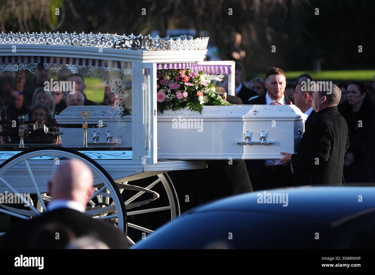 The coffin arrives by horse drawn hearse for the funeral of Chloe Hipson at Daldowie Crematorium in Glasgow. 21-year-old Chloe was one of five people killed when their Volkswagen Golf was in a collision with a Toyota Land Cruiser on a road near Dundalk on November 15. Picture date: Tuesday December 2, 2025. Stock Photo