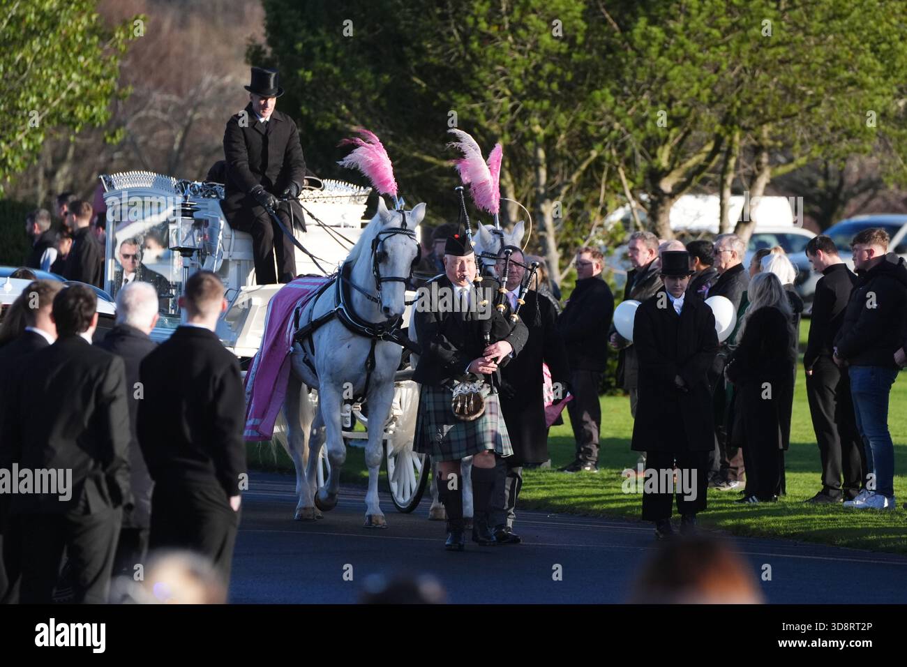 The coffin arrives by horse drawn hearse for the funeral of Chloe Hipson at Daldowie Crematorium in Glasgow. 21-year-old Chloe was one of five people killed when their Volkswagen Golf was in a collision with a Toyota Land Cruiser on a road near Dundalk on November 15. Picture date: Tuesday December 2, 2025. Stock Photo