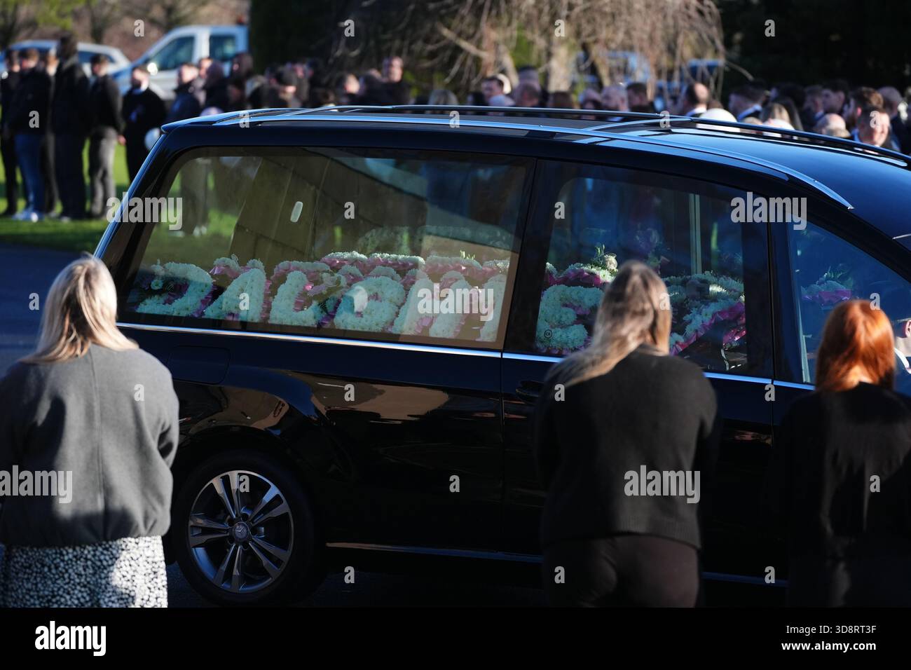 The hearse arriving with floral tributes for the funeral of Chloe Hipson at Daldowie Crematorium in Glasgow. 21-year-old Chloe was one of five people killed when their Volkswagen Golf was in a collision with a Toyota Land Cruiser on a road near Dundalk on November 15. Picture date: Tuesday December 2, 2025. Stock Photo