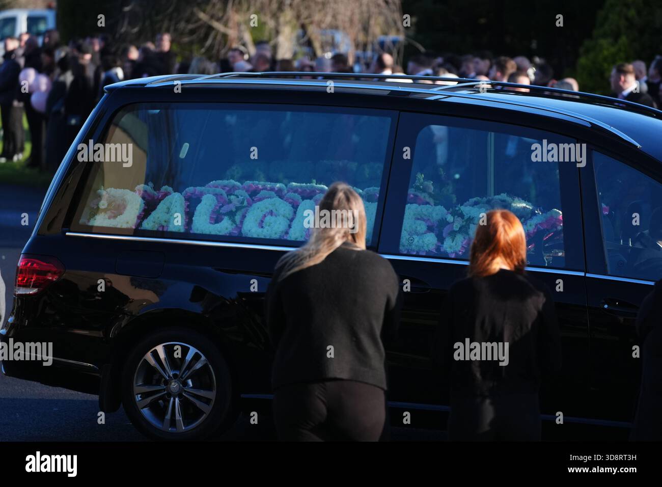 The hearse arriving with floral tributes for the funeral of Chloe Hipson at Daldowie Crematorium in Glasgow. 21-year-old Chloe was one of five people killed when their Volkswagen Golf was in a collision with a Toyota Land Cruiser on a road near Dundalk on November 15. Picture date: Tuesday December 2, 2025. Stock Photo