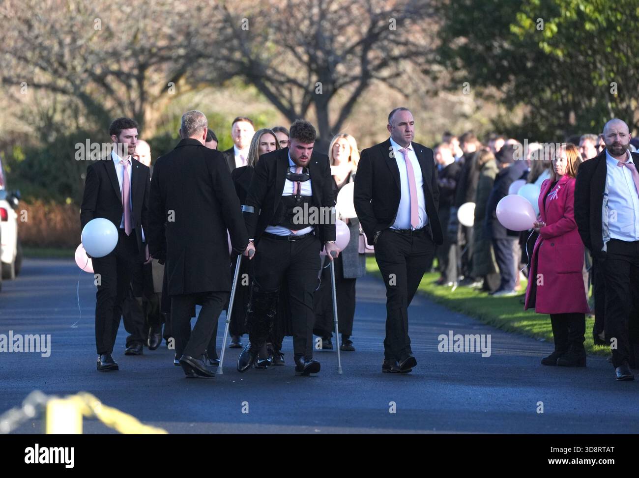 Mourners arriving the funeral of Chloe Hipson at Daldowie Crematorium in Glasgow. 21-year-old Chloe was one of five people killed when their Volkswagen Golf was in a collision with a Toyota Land Cruiser on a road near Dundalk on November 15. Picture date: Tuesday December 2, 2025. Stock Photo