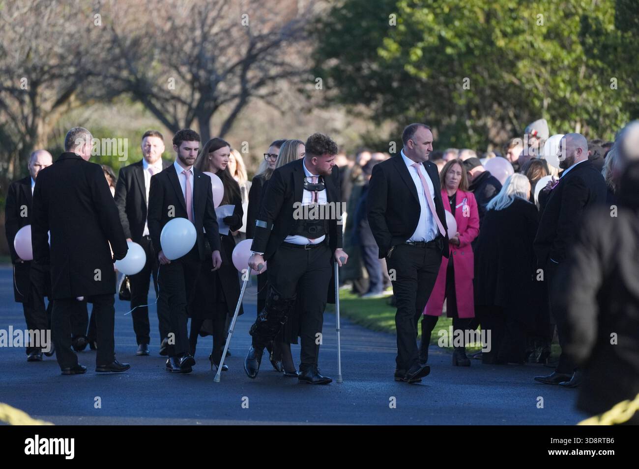 Mourners arriving the funeral of Chloe Hipson at Daldowie Crematorium in Glasgow. 21-year-old Chloe was one of five people killed when their Volkswagen Golf was in a collision with a Toyota Land Cruiser on a road near Dundalk on November 15. Picture date: Tuesday December 2, 2025. Stock Photo