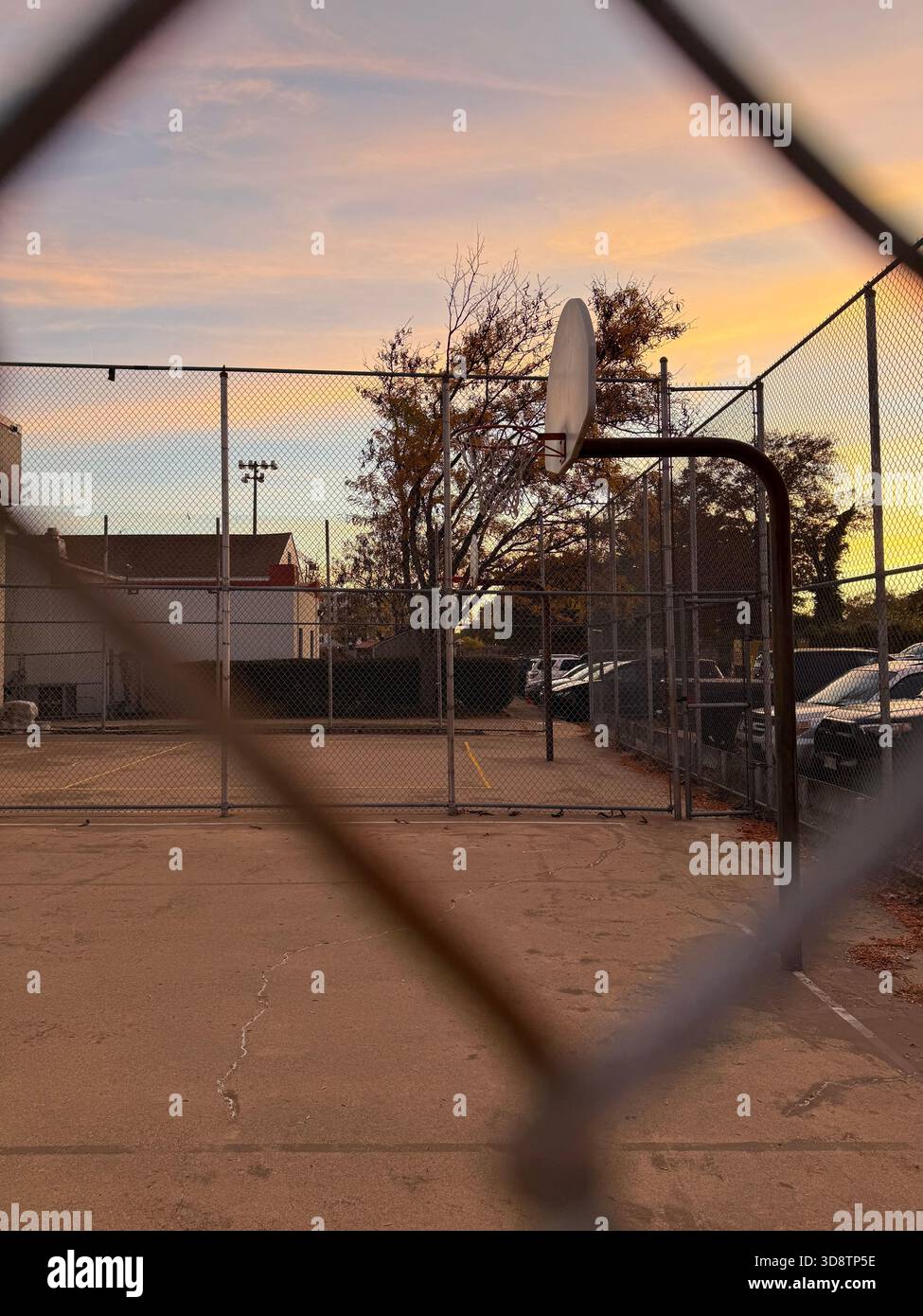 Basketball court seen through chain-link fence - Smartphone Captured Stock Image
