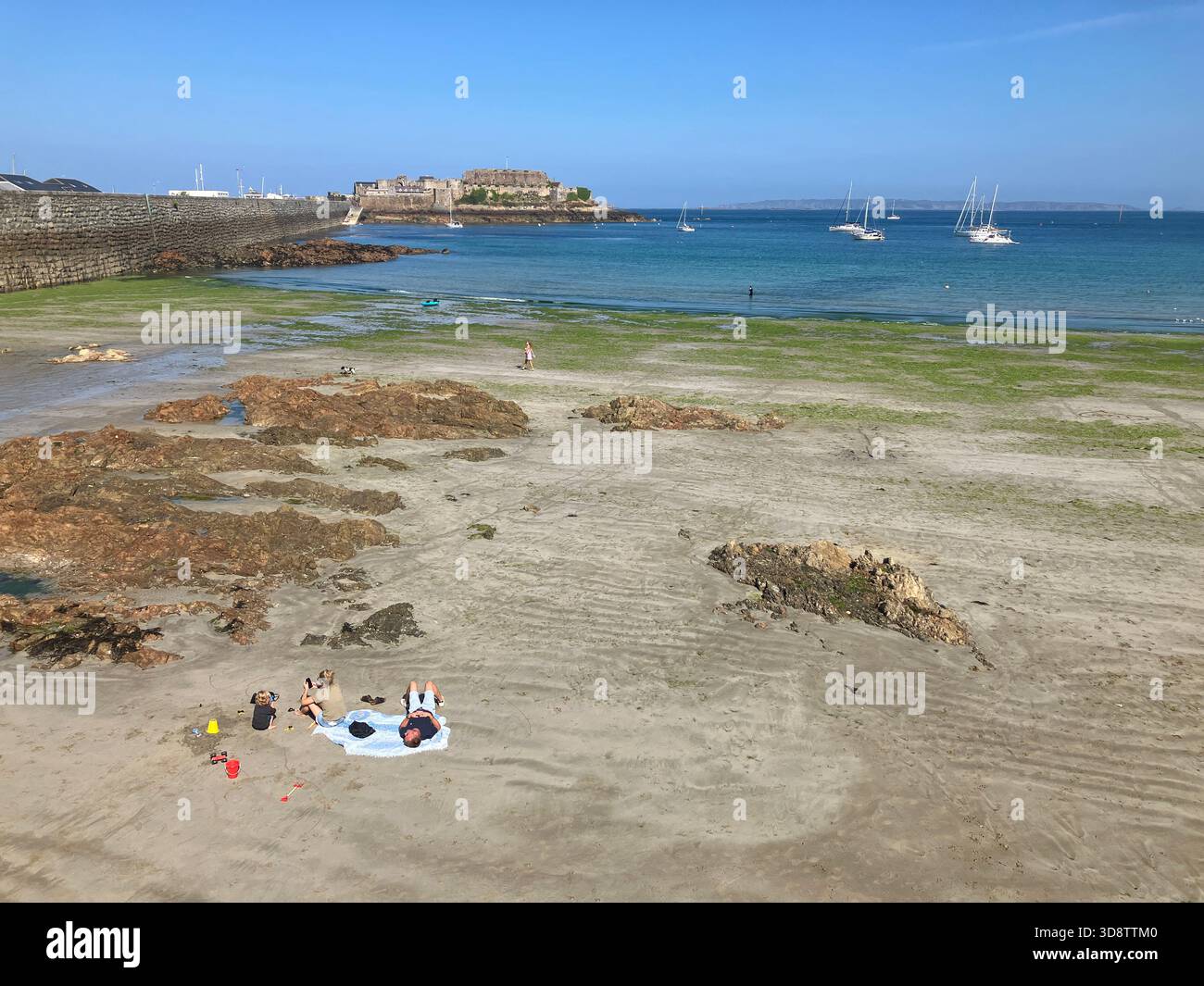 British Channel Islands. Guernsey. St Peter Port. View of Castle Cornet from Havelet Beach. Stock Photo