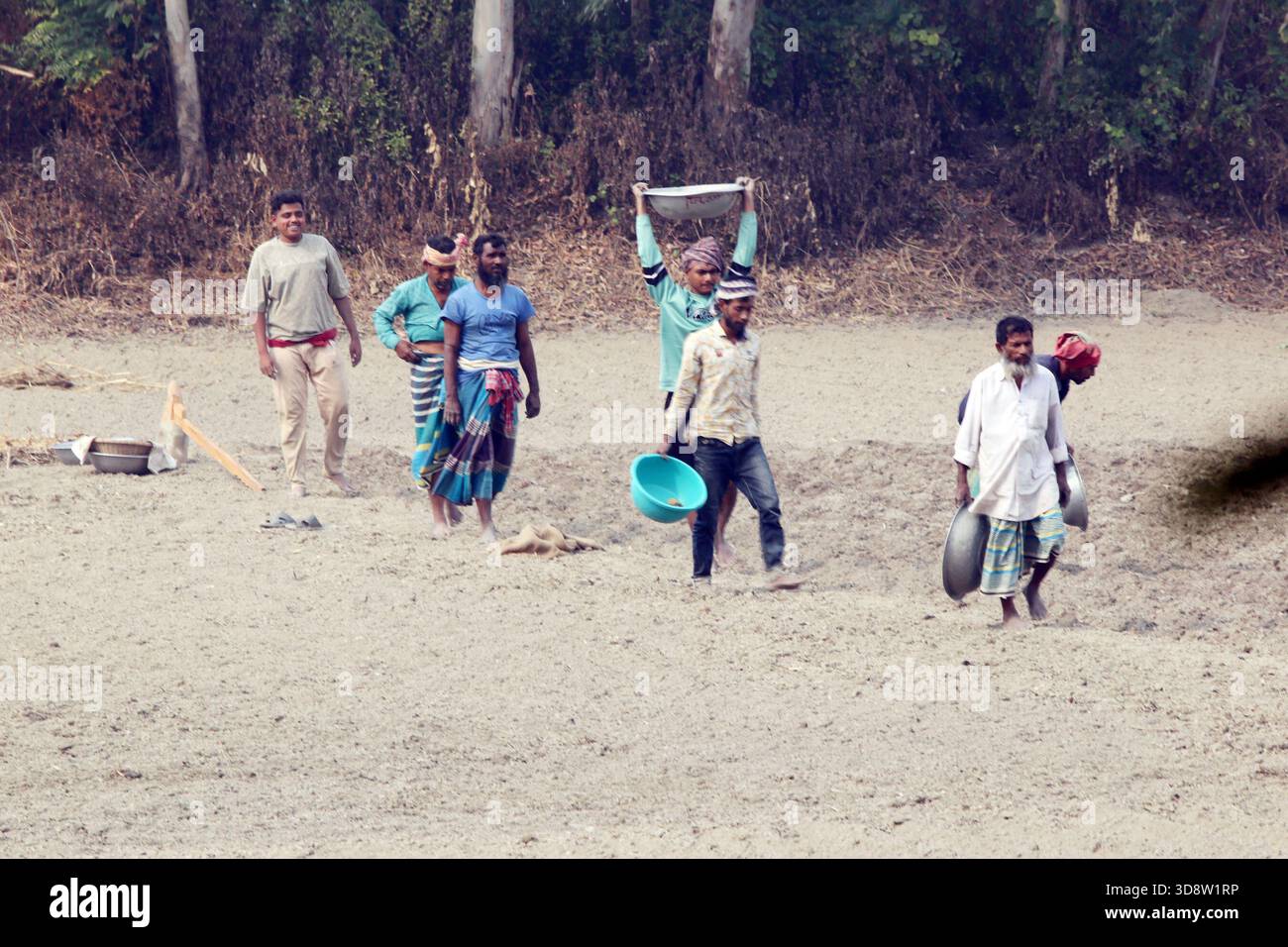 Dhaka, Munshigong, Bangladesh. 2nd Dec, 2025. 2 december 2025 Bangladesh:As winter approaches, farmers across the country have become busy preparing their fields for potato cultivation. They are carefully tilling the soil, burning the leftover straw and mixing the resulting ash into the land''”an age-old method of creating natural fertilizer.In many fields, potato planting has already begun. Farmers are hopeful that by next March the fields will be filled with the golden harvest of fresh potatoes.Last year, in 2024, farmers cultivated potatoes on 35,779 hectares of land. This year, in 2 Stock Photo
