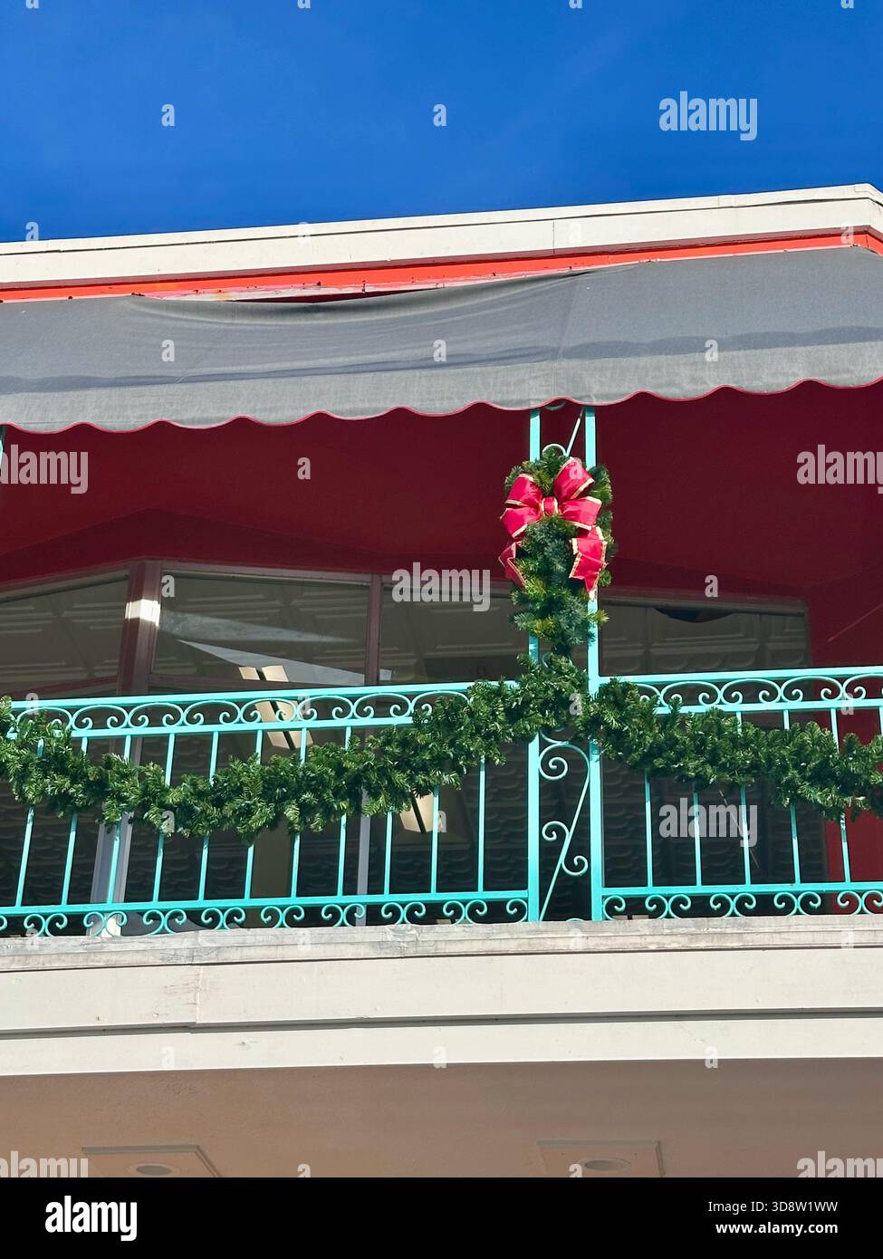 Christmas Garland and Red Balcony Decorations - Smartphone Captured Stock Image