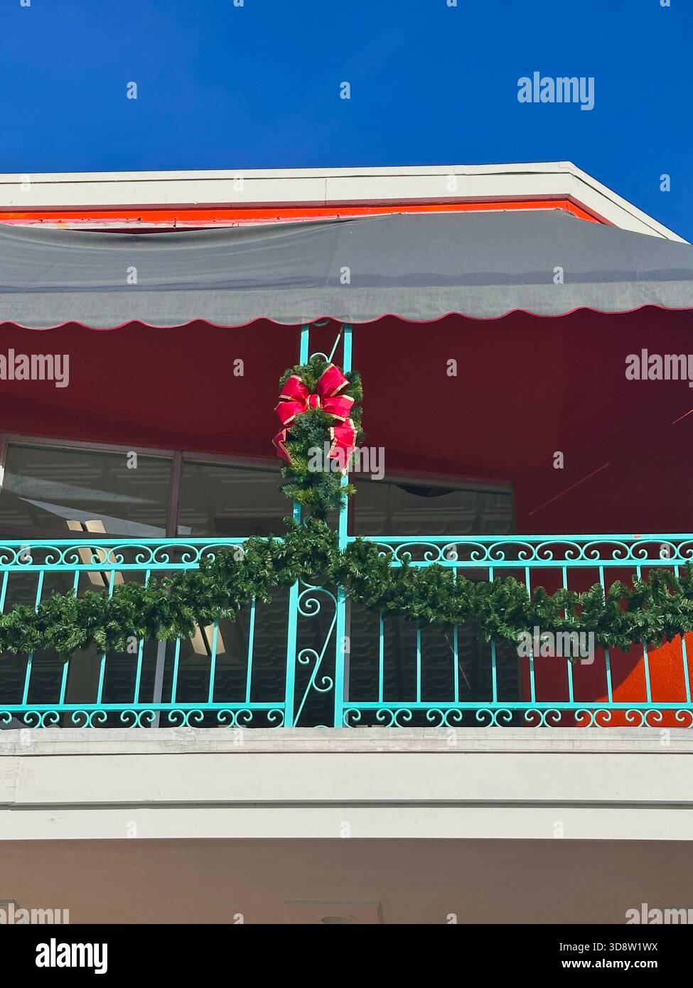 Christmas Garland and Red Balcony Decorations - Smartphone Captured Stock Image