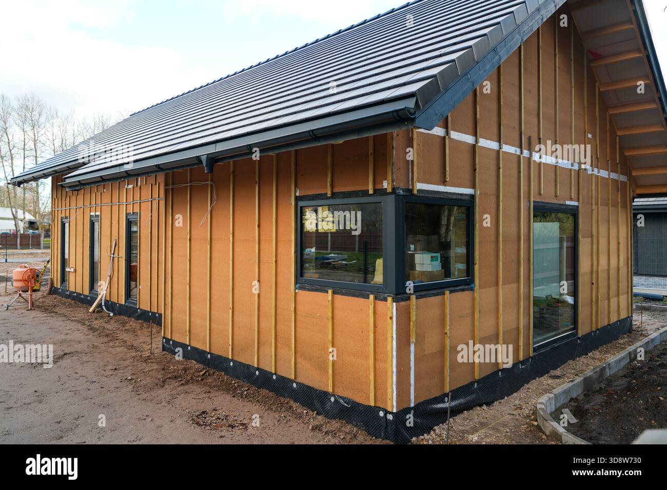 Modern house under construction with wood fiber insulation panels and ...