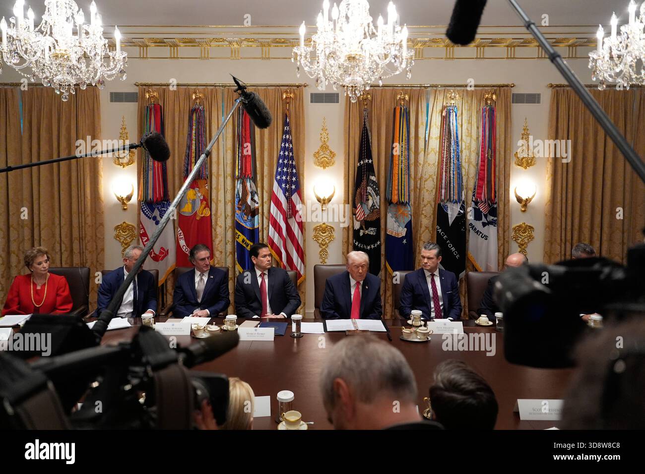 President Donald Trump, center, speaks during a cabinet meeting at the ...