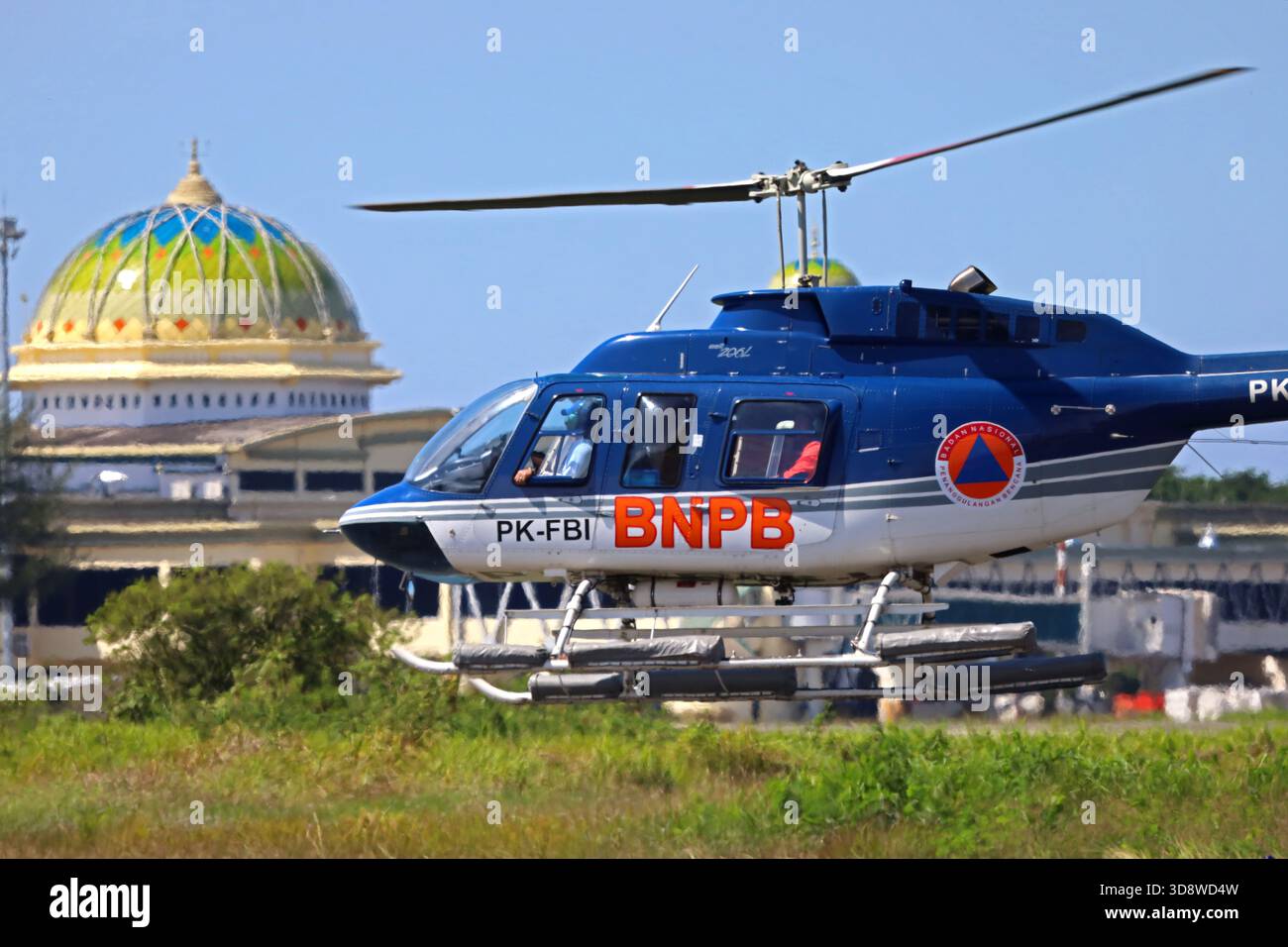 Aceh Besar, Aceh, Indonesia. 2nd Dec, 2025. An Aceh flood relief helicopter prepares to land at Sultan Iskandar Muda airport, Aceh province, Indonesia on Monday, December 02, 2025. Various types of military and commercial aircraft, traffic at Sultan Iskandar Muda Airport, Aceh province, to support the distribution of aid to victims of the aceh flood disaster has been isolated since November 26, 2025. (Credit Image: © Khairu Syukrillah/ZUMA Press Wire) EDITORIAL USAGE ONLY! Not for Commercial USAGE! Stock Photo