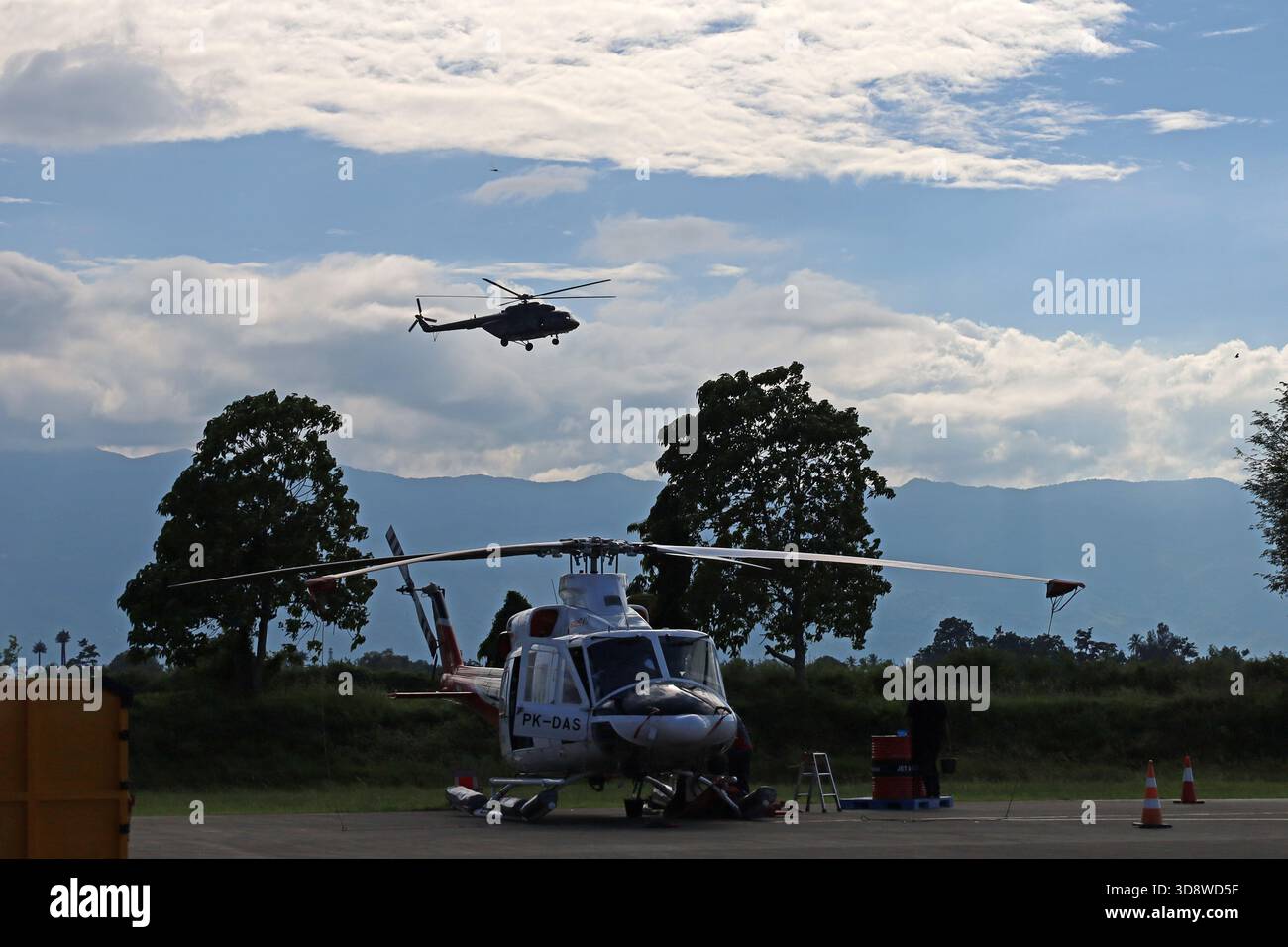 Aceh Besar, Aceh, Indonesia. 2nd Dec, 2025. An Aceh flood relief helicopter prepares to land at Sultan Iskandar Muda airport, Aceh province, Indonesia on Monday, December 02, 2025. Various types of military and commercial aircraft, traffic at Sultan Iskandar Muda Airport, Aceh province, to support the distribution of aid to victims of the aceh flood disaster has been isolated since November 26, 2025. (Credit Image: © Khairu Syukrillah/ZUMA Press Wire) EDITORIAL USAGE ONLY! Not for Commercial USAGE! Stock Photo
