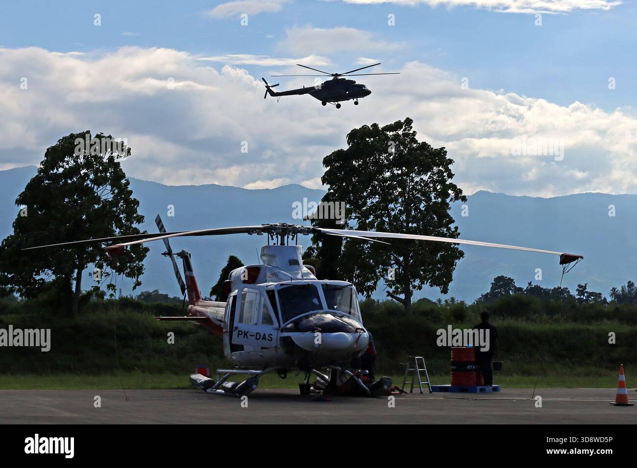 Aceh Besar, Aceh, Indonesia. 2nd Dec, 2025. An Aceh flood relief helicopter prepares to land at Sultan Iskandar Muda airport, Aceh province, Indonesia on Monday, December 02, 2025. Various types of military and commercial aircraft, traffic at Sultan Iskandar Muda Airport, Aceh province, to support the distribution of aid to victims of the aceh flood disaster has been isolated since November 26, 2025. (Credit Image: © Khairu Syukrillah/ZUMA Press Wire) EDITORIAL USAGE ONLY! Not for Commercial USAGE! Stock Photo