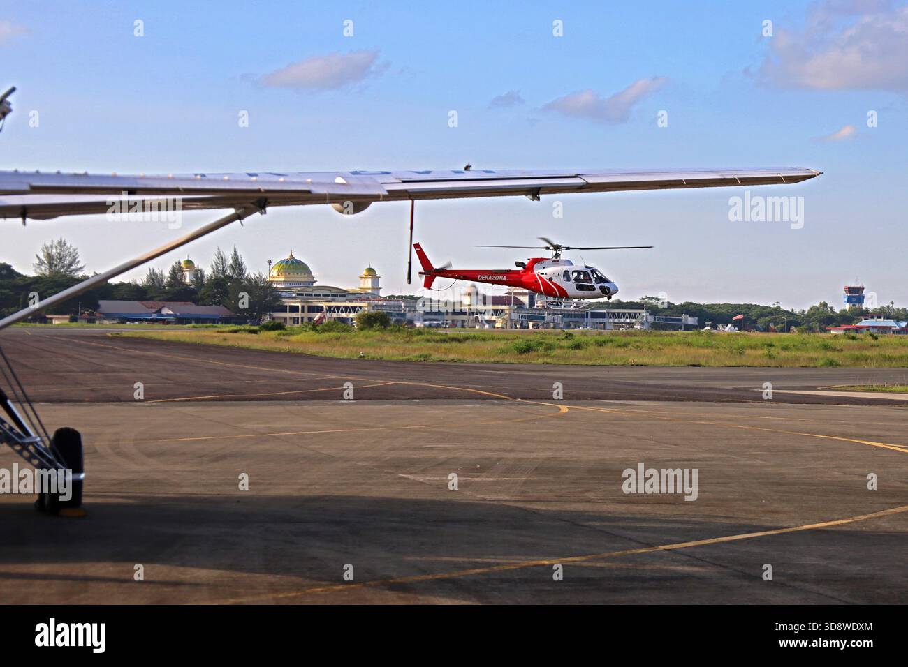 Aceh Besar, Aceh, Indonesia. 2nd Dec, 2025. An Aceh flood relief helicopter prepares to land at Sultan Iskandar Muda airport, Aceh province, Indonesia on Monday, December 02, 2025. Various types of military and commercial aircraft, traffic at Sultan Iskandar Muda Airport, Aceh province, to support the distribution of aid to victims of the aceh flood disaster has been isolated since November 26, 2025. (Credit Image: © Khairu Syukrillah/ZUMA Press Wire) EDITORIAL USAGE ONLY! Not for Commercial USAGE! Stock Photo