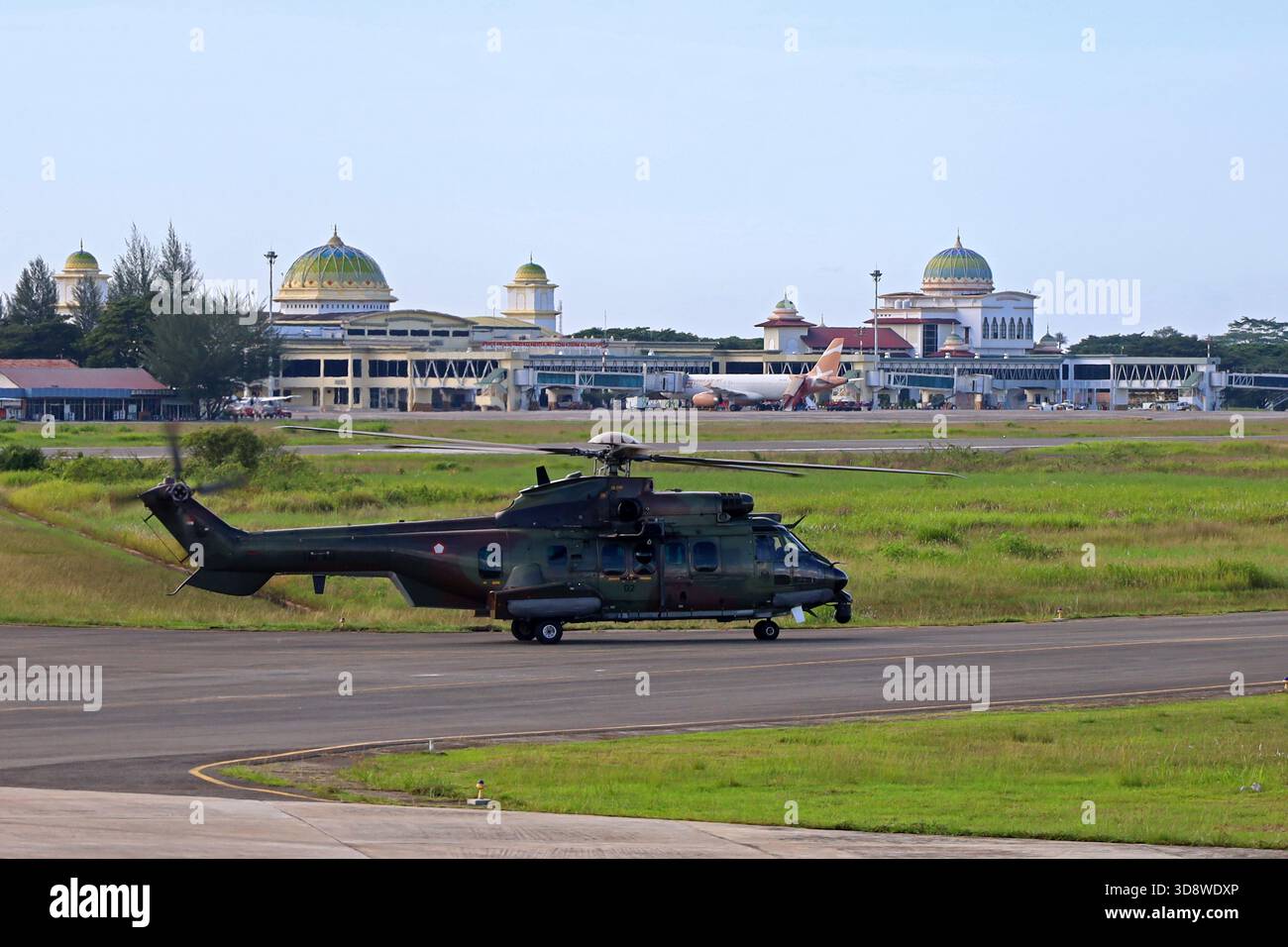 Aceh Besar, Aceh, Indonesia. 2nd Dec, 2025. An Aceh flood relief helicopter prepares to land at Sultan Iskandar Muda airport, Aceh province, Indonesia on Monday, December 02, 2025. Various types of military and commercial aircraft, traffic at Sultan Iskandar Muda Airport, Aceh province, to support the distribution of aid to victims of the aceh flood disaster has been isolated since November 26, 2025. (Credit Image: © Khairu Syukrillah/ZUMA Press Wire) EDITORIAL USAGE ONLY! Not for Commercial USAGE! Stock Photo