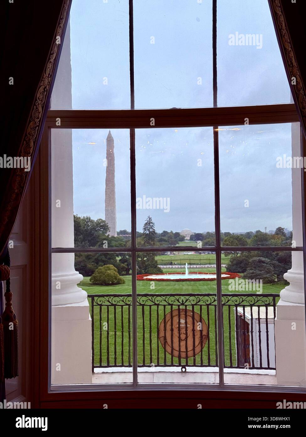 Looking out of the window of the White House in Washington, DC - Smartphone Captured Stock Image