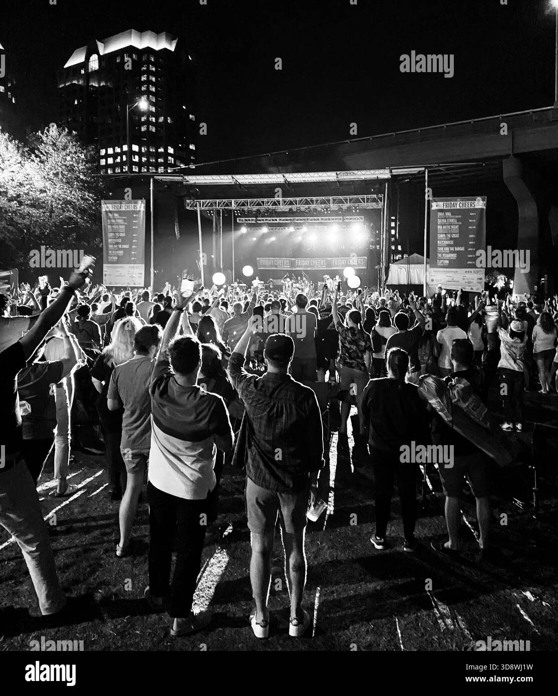 Crowd holding their cell phones in the air at a Tank and the Bangas concert at Friday Cheers at Brown's Island in Richmond, VA USA - Smartphone Captured Stock Image