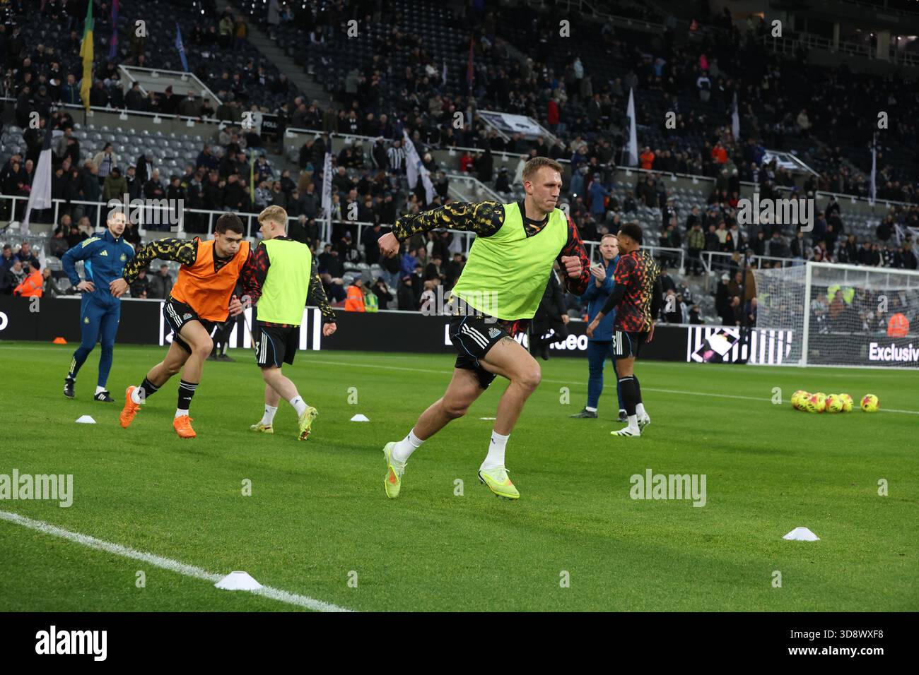 Newcastle Upon Tyne, UK. 2nd Dec, 2025. Dna Burn of Newcastle United warms up during the Newcastle United vs Tottenham Hotspur Premier League match at St. James' Park, Newcastle Upon Tyne. Picture credit should read: Nigel Roddis/Sportimage Credit: Sportimage Ltd/Alamy Live News Stock Photo