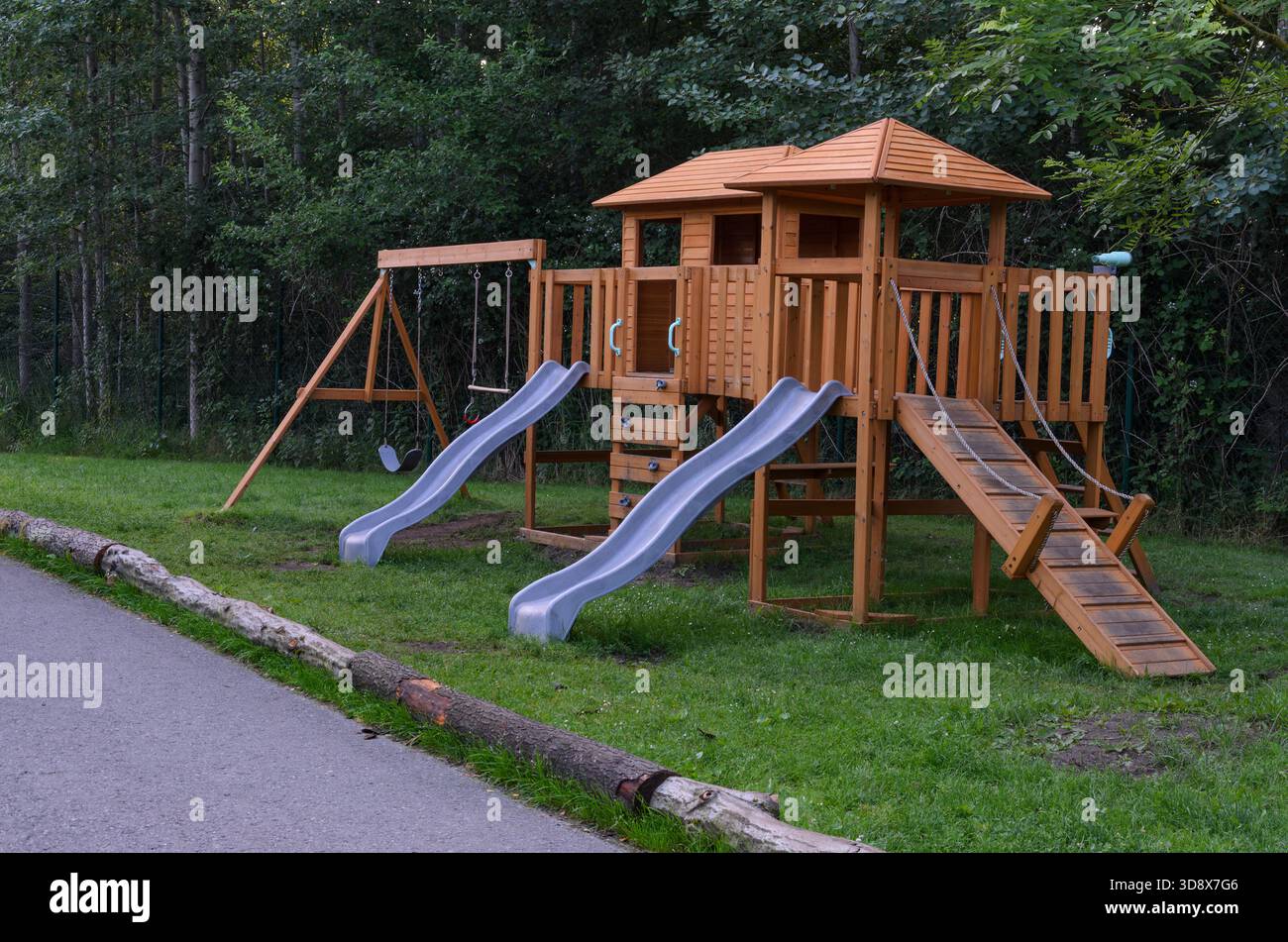 Empty Wooden Playground Structure with Slides Outdoors Stock Photo - Alamy