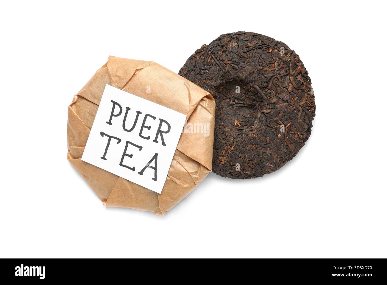 Dry pressed puer tea and sticky note on white background Stock Photo
