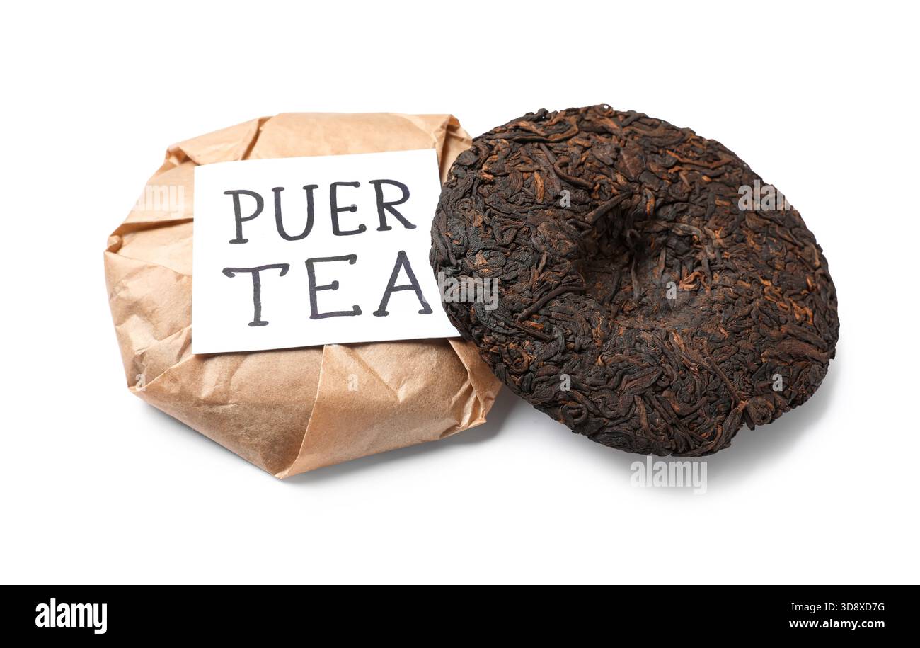 Dry pressed puer tea with sticky note on white background Stock Photo