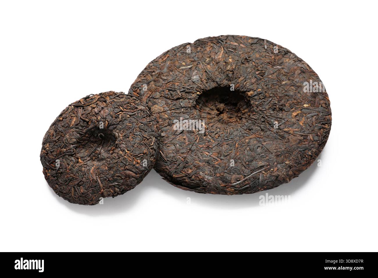 Dry compressed puer tea on white background Stock Photo - Alamy