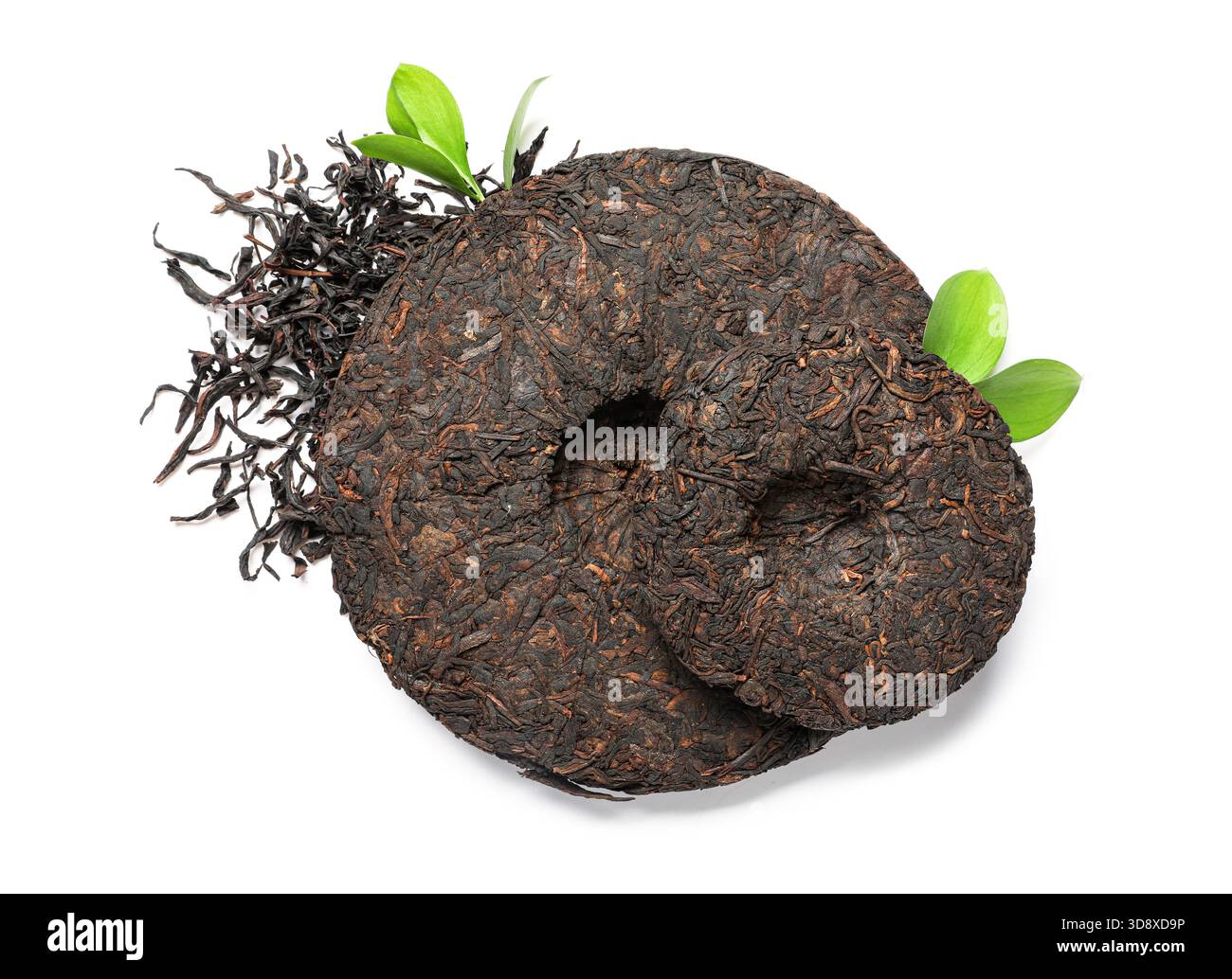 Dry compressed puer tea with fresh leaves on white background Stock ...