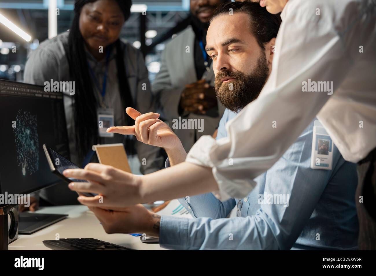 Software developers in data center using computer, verifying firewall configurations. Coworking employees doing brainstorming, performing equipment vulnerability scans in server room using PC Stock Photo