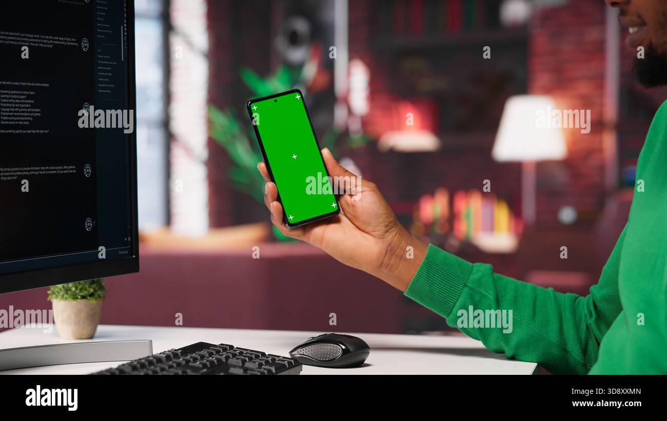 Black guy interacting with intelligent AI chatbot on pc next to copy space screen, using smart innovative system. Machine learning enhances efficiency through advanced algorithms. Camera A. Stock Photo