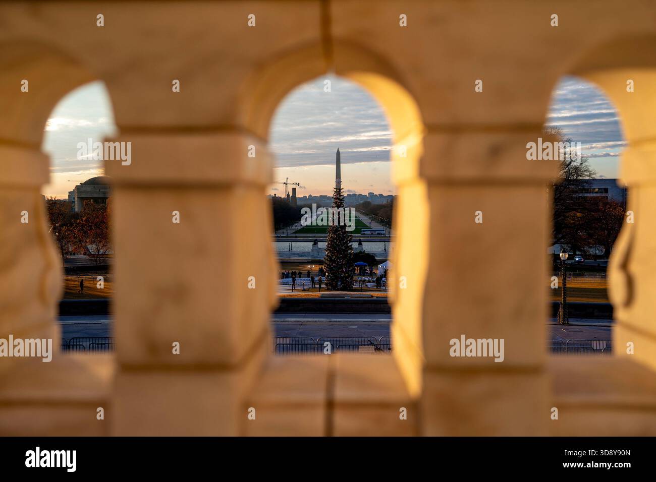 Washington, United States. 02nd Dec, 2025. The 2025 Capitol Christmas tree is seen against the Washington Monument before a ceremony with Speaker of the House Mike Johnson, R-LA, members of the Nevada Congressional delegation and the Secretary of Agriculture to light the tree on the West Front Lawn of the U.S. Capitol in Washington, DC on Tuesday, December 2, 2025. The tree, a 53-foot red fir from the Humboldt-Toiyabe National Forest in Nevada, is nicknamed 'Silver Belle' and is the first Capitol Christmas Tree to be selected from Nevada. Photo by Bonnie Cash/UPI Credit: UPI/Alamy Live News Stock Photo