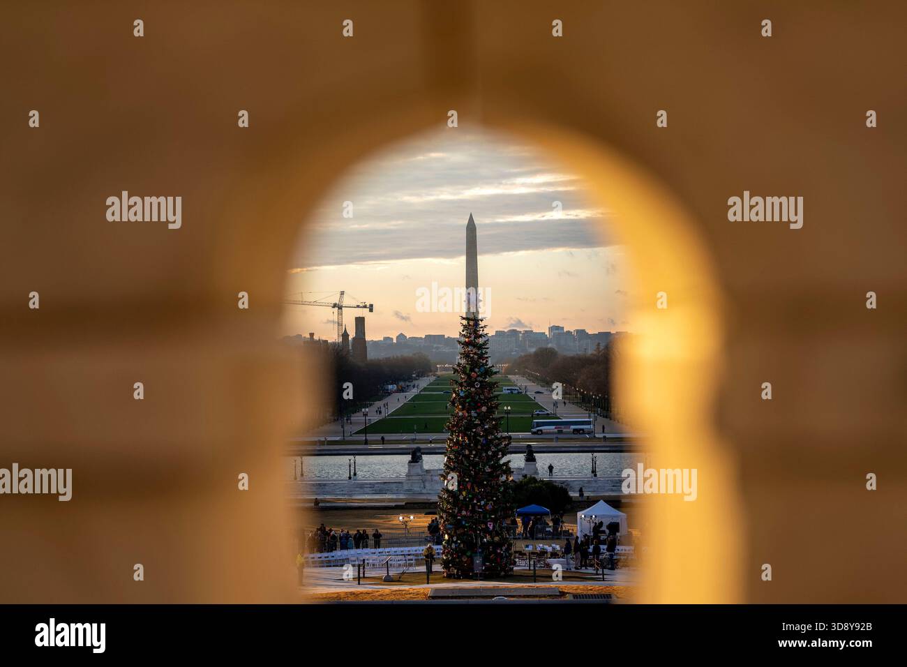 Washington, United States. 02nd Dec, 2025. The 2025 Capitol Christmas tree is seen against the Washington Monument before a ceremony with Speaker of the House Mike Johnson, R-LA, members of the Nevada Congressional delegation and the Secretary of Agriculture to light the tree on the West Front Lawn of the U.S. Capitol in Washington, DC on Tuesday, December 2, 2025. The tree, a 53-foot red fir from the Humboldt-Toiyabe National Forest in Nevada, is nicknamed 'Silver Belle' and is the first Capitol Christmas Tree to be selected from Nevada. Photo by Bonnie Cash/UPI Credit: UPI/Alamy Live News Stock Photo