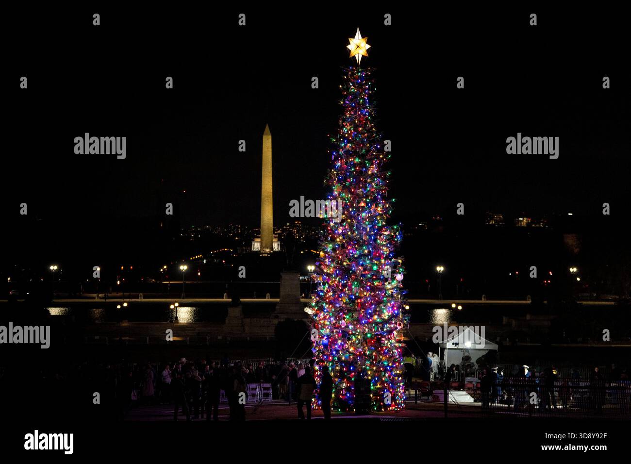 Washington, United States. 02nd Dec, 2025. The 2025 Capitol Christmas tree is seen against the Washington Monument after a ceremony with Speaker of the House Mike Johnson, R-LA, members of the Nevada Congressional delegation and the Secretary of Agriculture to light the tree on the West Front Lawn of the U.S. Capitol in Washington, DC on Tuesday, December 2, 2025. The tree, a 53-foot red fir from the Humboldt-Toiyabe National Forest in Nevada, is nicknamed 'Silver Belle' and is the first Capitol Christmas Tree to be selected from Nevada. Photo by Bonnie Cash/UPI Credit: UPI/Alamy Live News Stock Photo