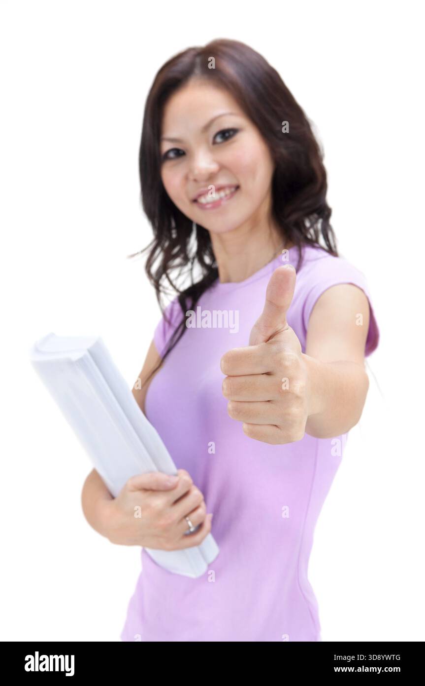 Female student thumbs up with great smile Stock Photo - Alamy
