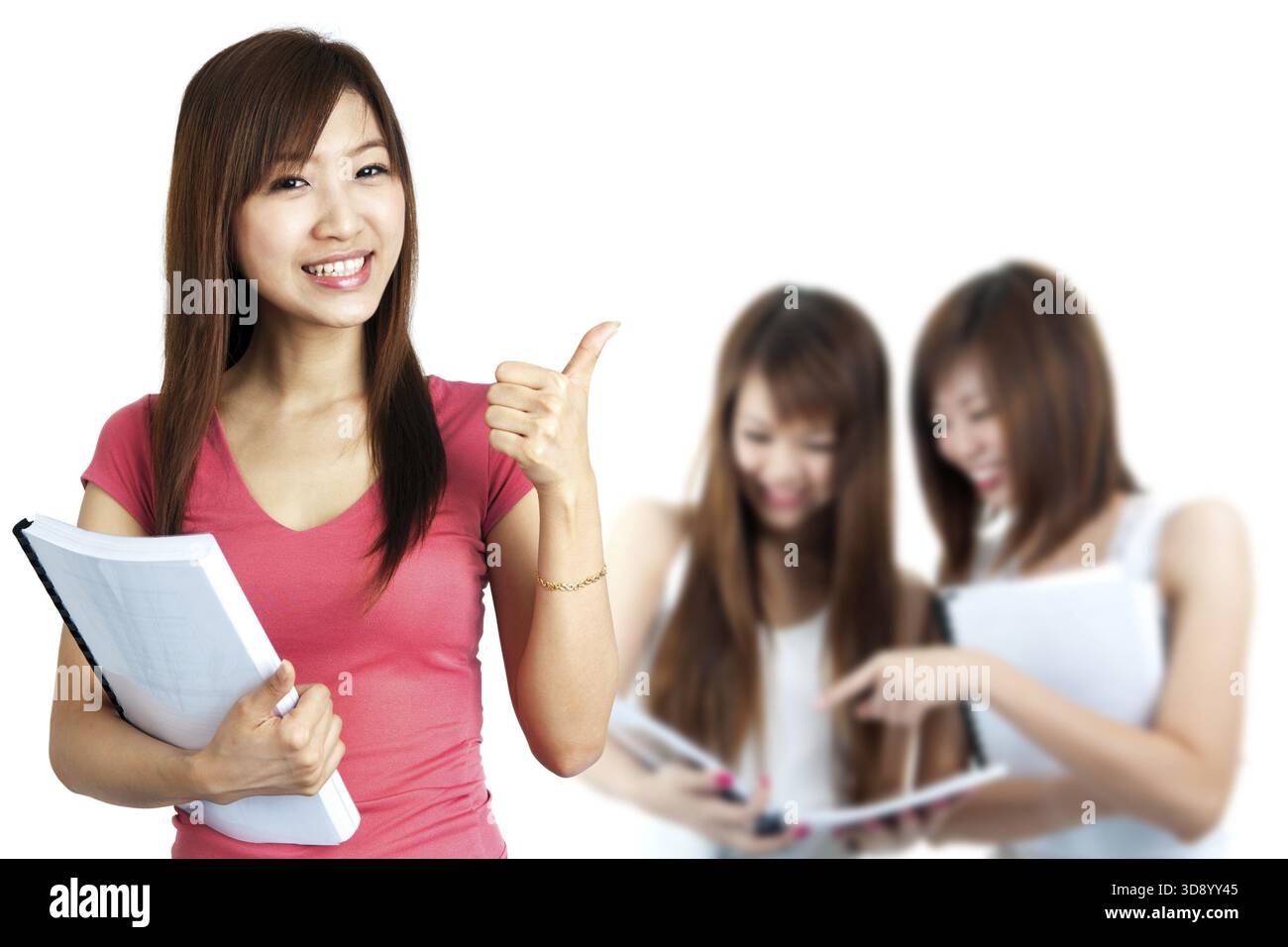 Female student thumbs up with great smile Stock Photo - Alamy