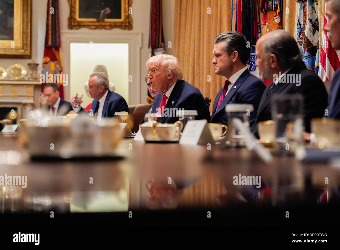 President Donald Trump, center, speaks during a Cabinet meeting at the ...