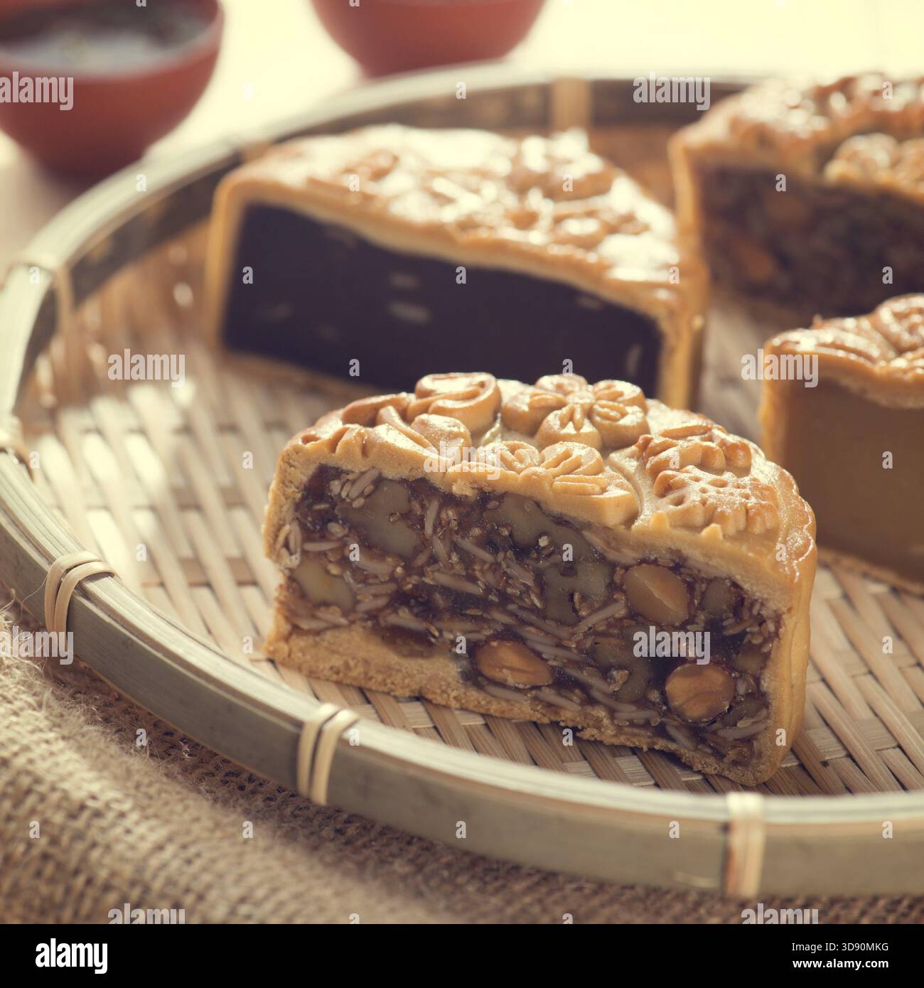 Chinese mid autumn festival foods. Traditional mooncakes on bamboo tray ...