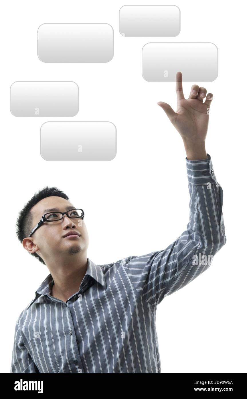 Asian businessman hand pointing on visual screen, standing isolated on white background Stock Photo