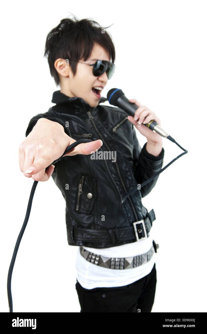 Asian rock singer in performance, isolated on white, focus on fingers ...