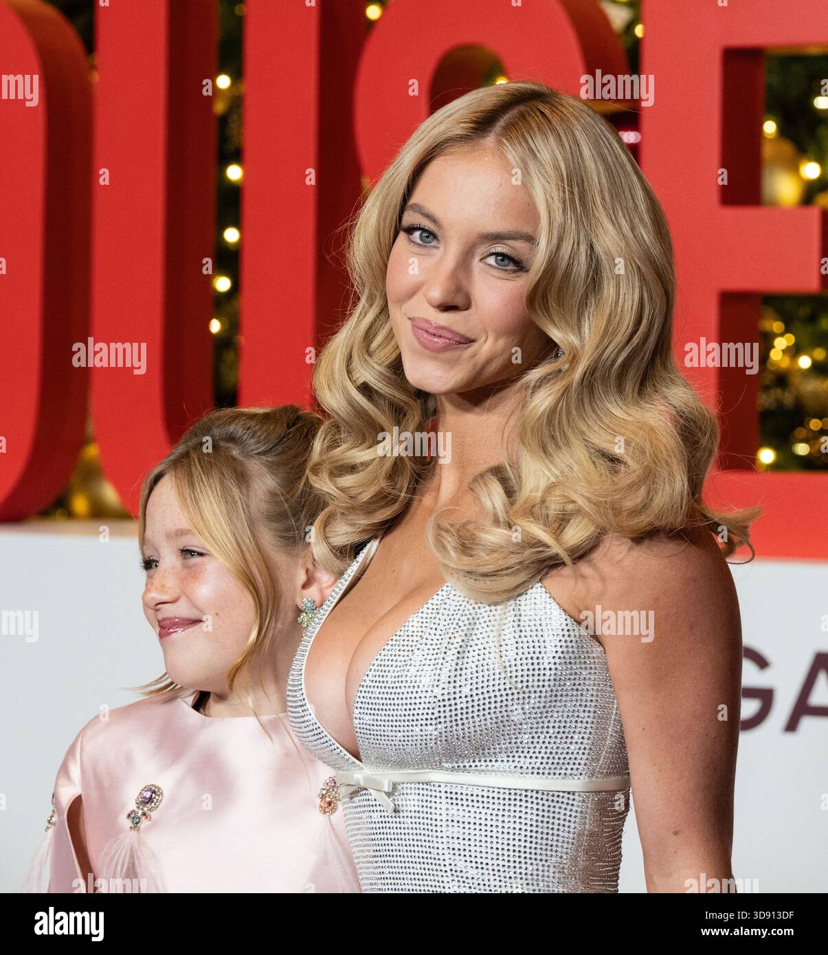 princess polly baby blue dress Sydney Sweeney wearing dress by Miu Miu attends premiere of 'The Housemaid'  at BNP Paribas atrium in New York, NY on December 2, 2025 Stock Photo