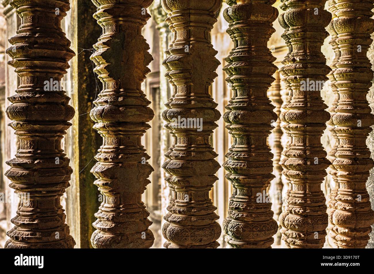 Architecture theme. Row of carved stone balusters in ancient temple ...