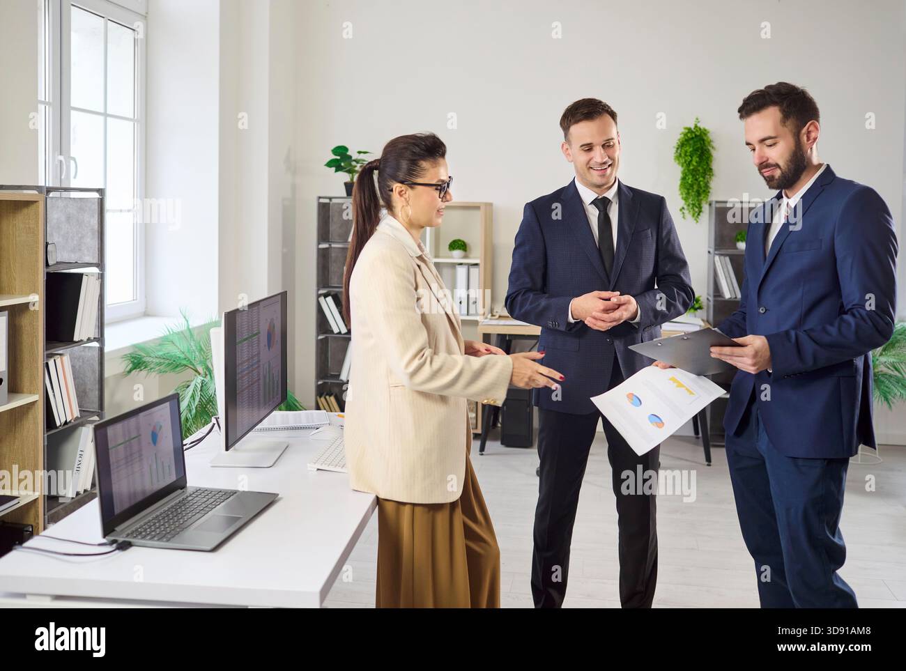 Business colleagues discussing reports in office, strategy planning and teamwork Stock Photo