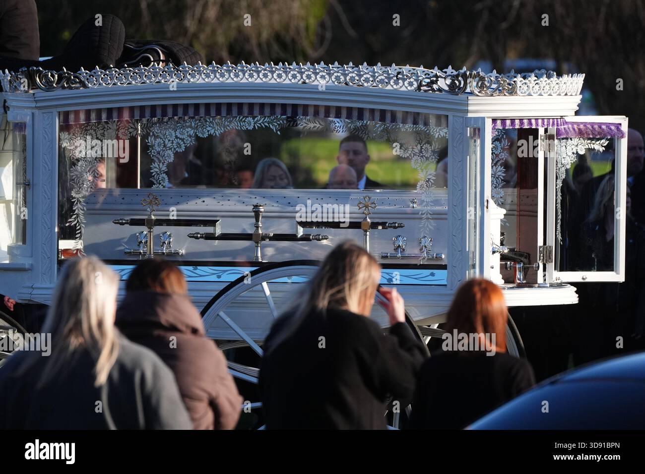 The coffin arrives by horse drawn hearse for the funeral of Chloe Hipson at Daldowie Crematorium in Glasgow. 21-year-old Chloe was one of five people killed when their Volkswagen Golf was in a collision with a Toyota Land Cruiser on a road near Dundalk on November 15. Picture date: Tuesday December 2, 2025. Stock Photo
