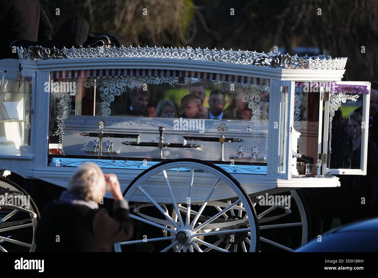 The coffin arrives by horse drawn hearse for the funeral of Chloe Hipson at Daldowie Crematorium in Glasgow. 21-year-old Chloe was one of five people killed when their Volkswagen Golf was in a collision with a Toyota Land Cruiser on a road near Dundalk on November 15. Picture date: Tuesday December 2, 2025. Stock Photo
