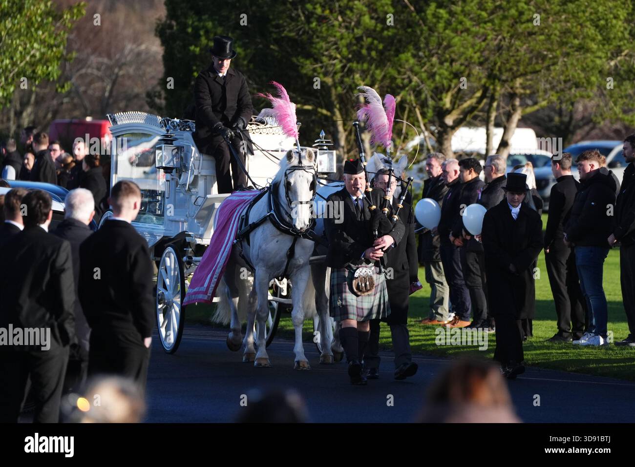 The coffin arrives by horse drawn hearse for the funeral of Chloe Hipson at Daldowie Crematorium in Glasgow. 21-year-old Chloe was one of five people killed when their Volkswagen Golf was in a collision with a Toyota Land Cruiser on a road near Dundalk on November 15. Picture date: Tuesday December 2, 2025. Stock Photo