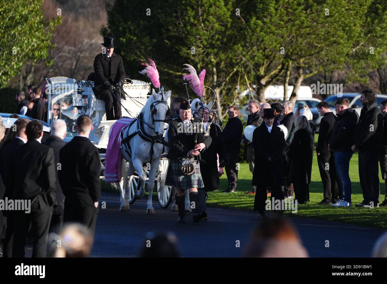 The coffin arrives by horse drawn hearse for the funeral of Chloe Hipson at Daldowie Crematorium in Glasgow. 21-year-old Chloe was one of five people killed when their Volkswagen Golf was in a collision with a Toyota Land Cruiser on a road near Dundalk on November 15. Picture date: Tuesday December 2, 2025. Stock Photo
