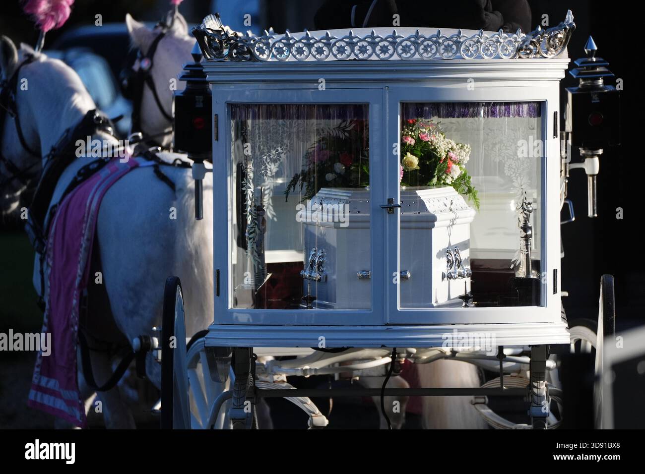 The coffin arrives by horse drawn hearse for the funeral of Chloe Hipson at Daldowie Crematorium in Glasgow. 21-year-old Chloe was one of five people killed when their Volkswagen Golf was in a collision with a Toyota Land Cruiser on a road near Dundalk on November 15. Picture date: Tuesday December 2, 2025. Stock Photo