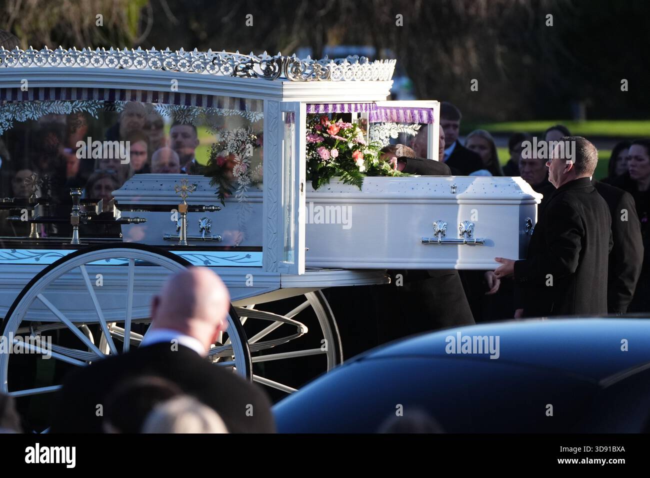 The coffin arrives by horse drawn hearse for the funeral of Chloe Hipson at Daldowie Crematorium in Glasgow. 21-year-old Chloe was one of five people killed when their Volkswagen Golf was in a collision with a Toyota Land Cruiser on a road near Dundalk on November 15. Picture date: Tuesday December 2, 2025. Stock Photo
