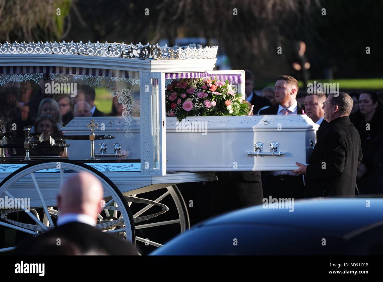 The coffin arrives by horse drawn hearse for the funeral of Chloe Hipson at Daldowie Crematorium in Glasgow. 21-year-old Chloe was one of five people killed when their Volkswagen Golf was in a collision with a Toyota Land Cruiser on a road near Dundalk on November 15. Picture date: Tuesday December 2, 2025. Stock Photo