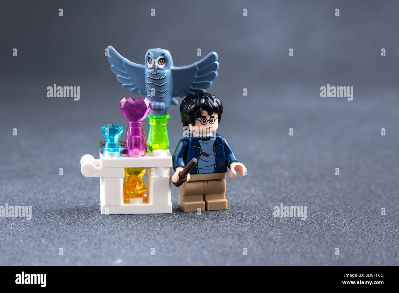 Lego man Harry Potter and owl mini figures toy bricks copy space. Ukraine, Kyiv - January 17, 2024. Stock Photo